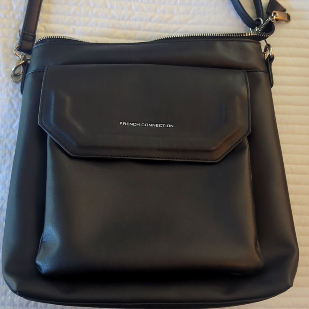 Multiple black women's handbags.